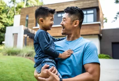 Man holding young boy